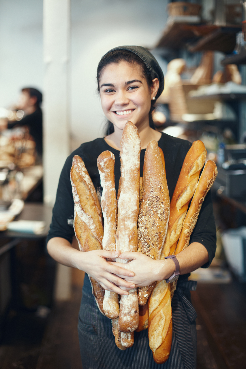 Saleswoman holding bread